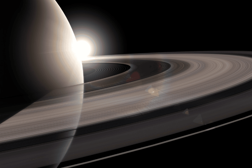 Vista próxima dos anéis de Saturno com luz ao fundo, imagem que ajuda a contextualizar a composição e a estrutura do planeta gasoso.