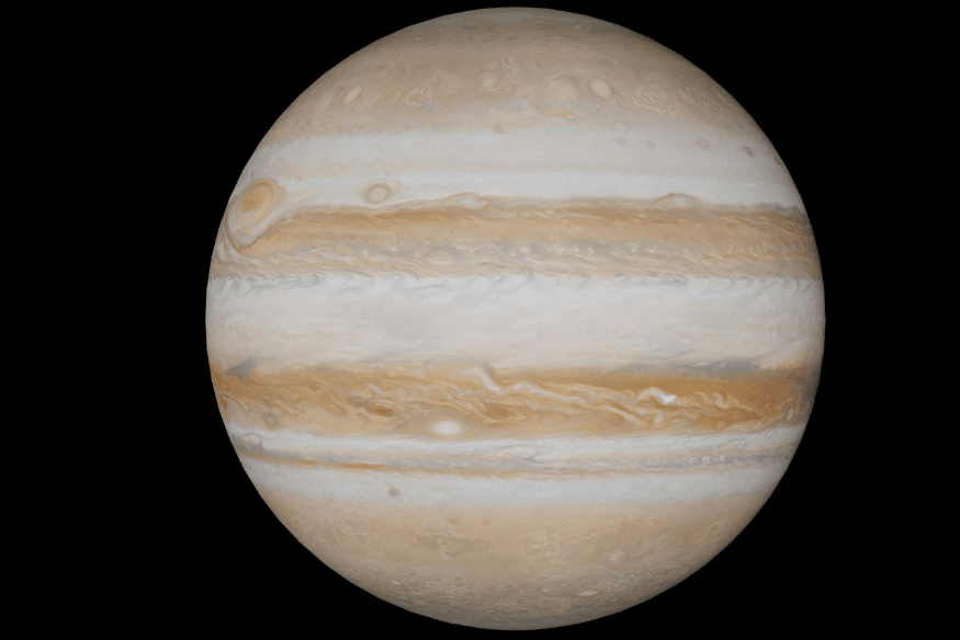 Júpiter em fundo preto com bandas de nuvens claras e escuras, mostrando a dinâmica atmosférica que forma gigantescas tempestades.